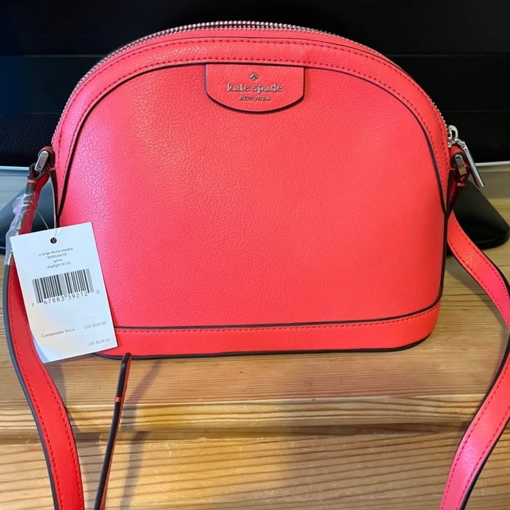 New with tags, never worn Kate Spade XL Dome Crossbody bag Color pink/orange